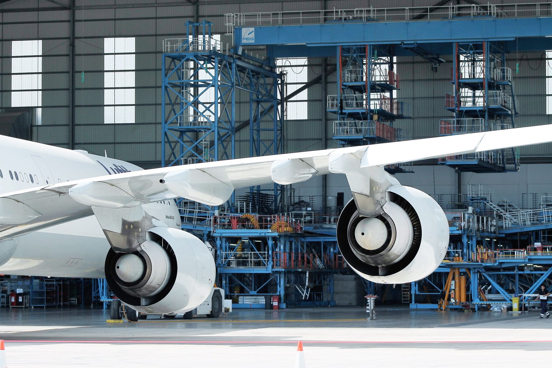 Aircraft wing and engines inside a maintenance hangar, photographed by Joe Ambrogio